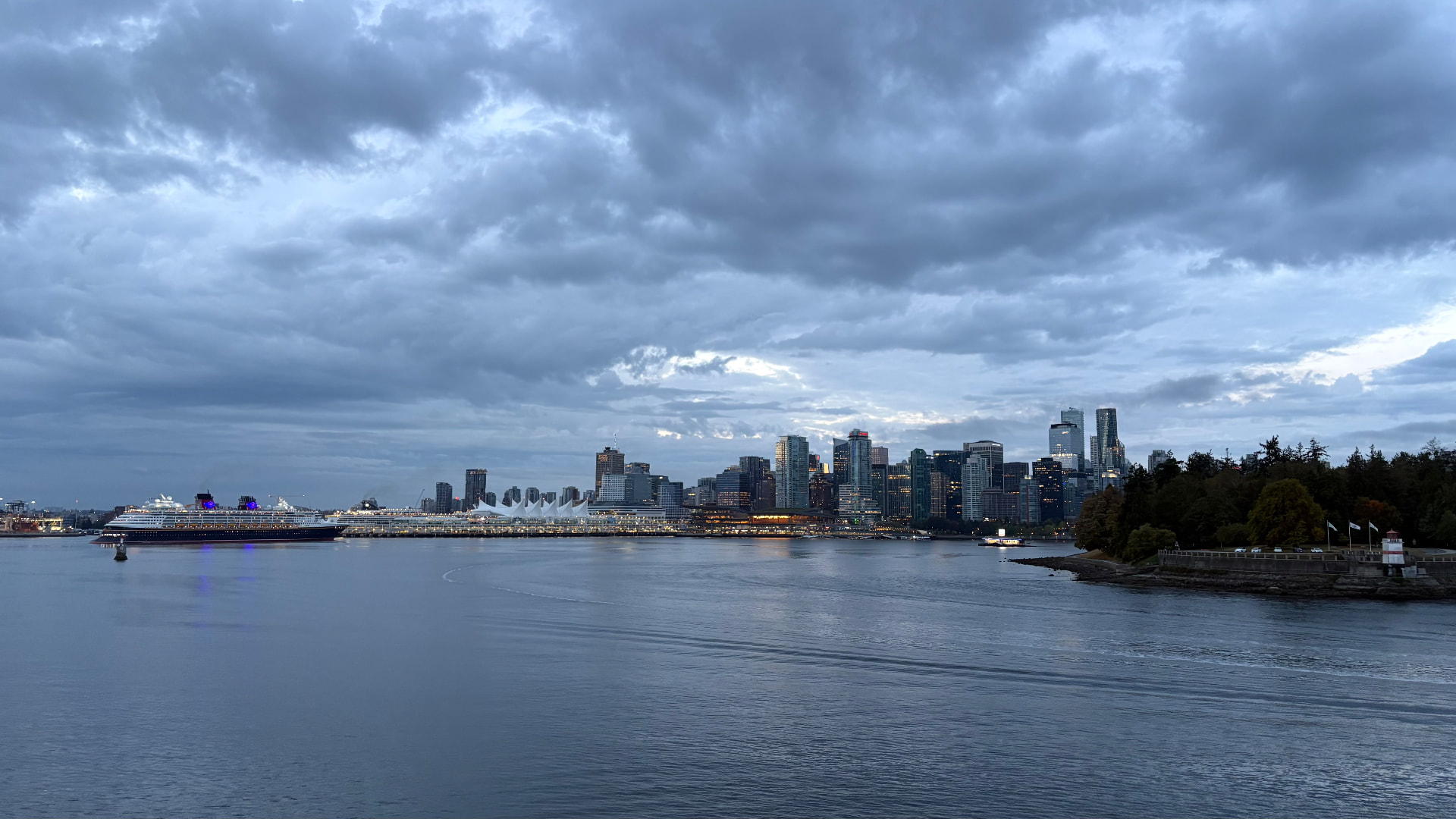 Vancouver harbour at dusk with Canada Place and the downtown skyline
